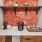  A counter with a coffee maker on a white counter.