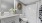  A white bathroom with a toilet, sink, and mirror.