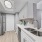  A kitchen with a sink, stove, and refrigerator.
