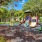  A playground with a slide, swings, and a climbing frame.